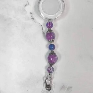 purple and blue cracked glass badge reel
